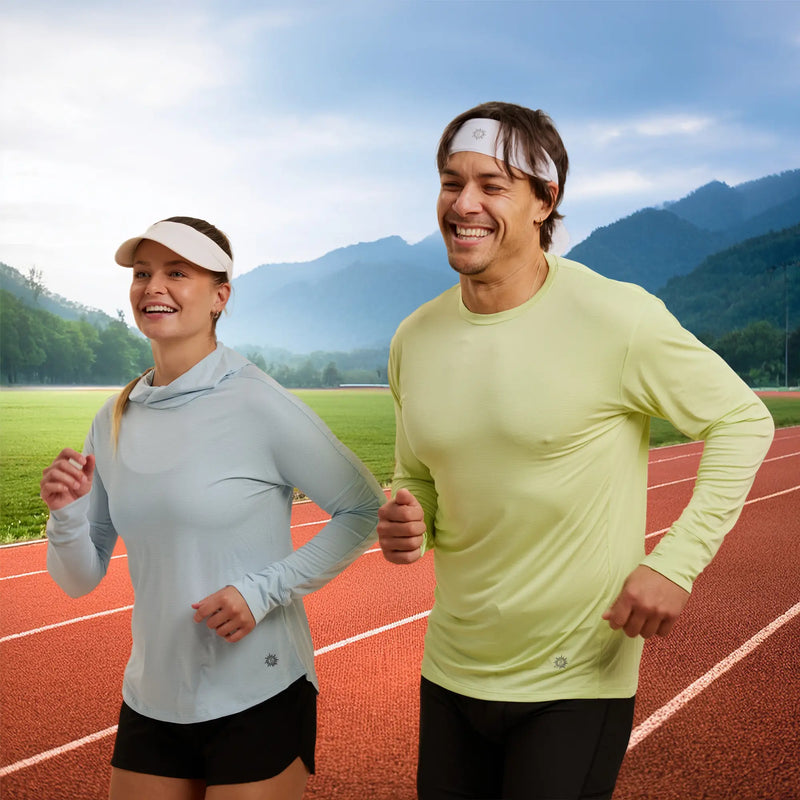 Man and woman running on a track wearing sun protection clothing by Belesun