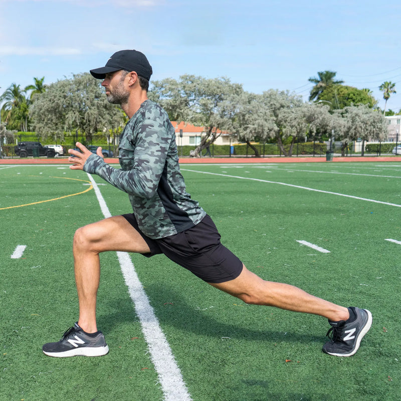 Athlete stretching wearing a UPF 50+ Belesun sun protection shirt