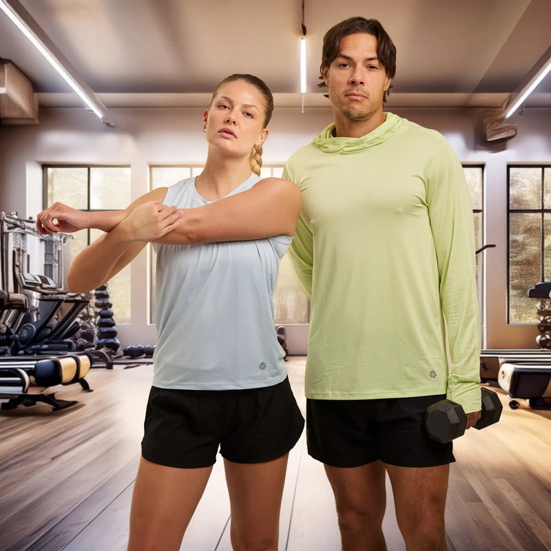 man and woman stretching in the gym in Belesun athletic wear