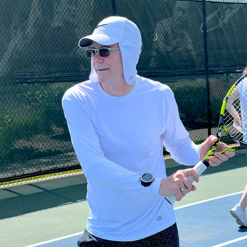 Man playing tennis wearing Belesun sun protection clothing